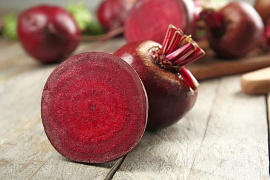 canva close up of beets on wooden table MAD MXCWM5Q