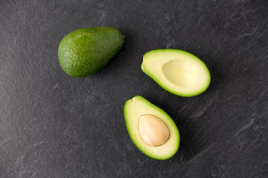 canva close up of ripe avocado on slate stone background MAEQQs6BJE4