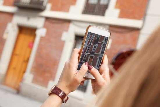 canva close up of woman taking a photo of apartment using smartphone MAD7iROWJ c
