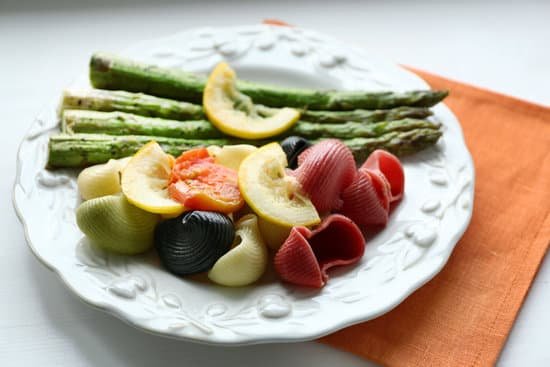 canva colorful pasta with roasted asparagus on plate MAD MW7IjXs