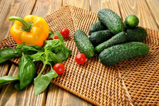 canva composition of cucumbers tomatoes and sweet peppers on wicker serviette MAD MlHY4mo
