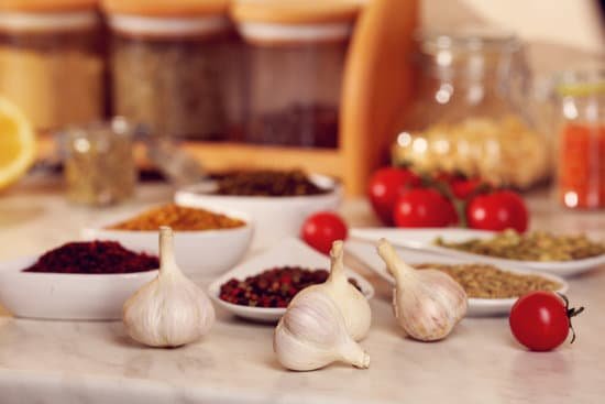 canva composition of spices and garlic on kitchen table MAD Miu9kuQ