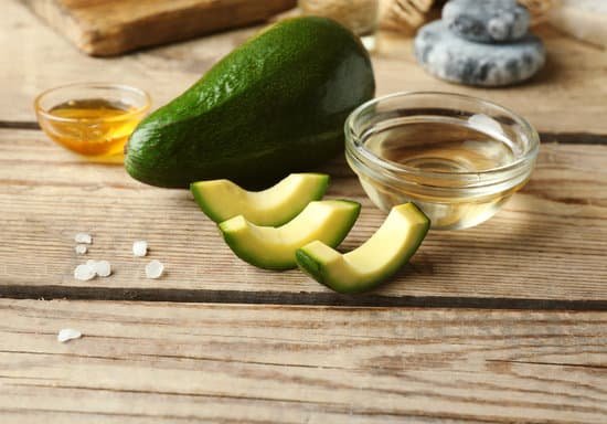 canva composition with avocado oil on wooden table top view MAD QiCyZK8