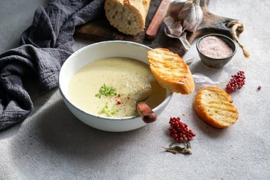 canva creamy garlic soup on a table MAD mETnQ0k