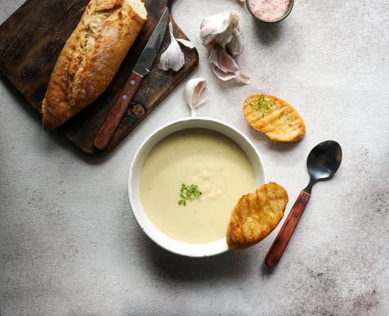 canva creamy garlic soup on a table MAD mJ2HftA