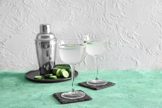 canva cucumber martini and a shaker on a textured background MAD7pCWY6Rs