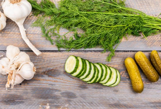 canva cucumber pickles dill and garlic on a table MAD gabLUPA