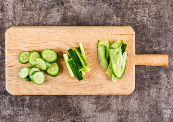 canva cucumber slices on a cutting board MAD gZccojw