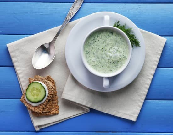 canva cucumber soup in bowl on color wooden background MAD MJ9eoKI