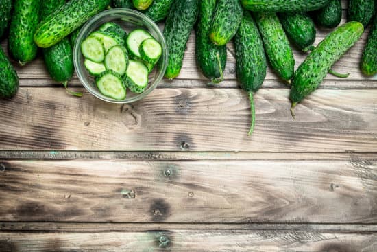 canva cucumbers and cucumber slices in a glass bowl. MAEPvGpqakI