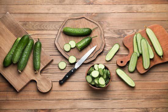 canva cucumbers on wooden table MAD6rPEfpHk