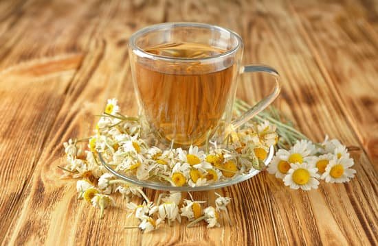 canva cup of chamomile tea on a wooden table MAD9bnmkJJo