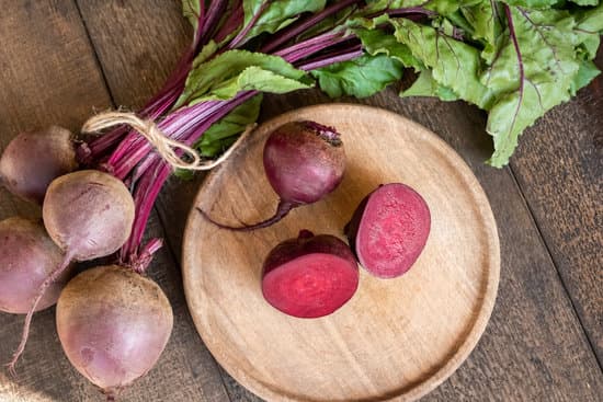 canva cut up red beets with leaves on a table MAEkB NsAiU