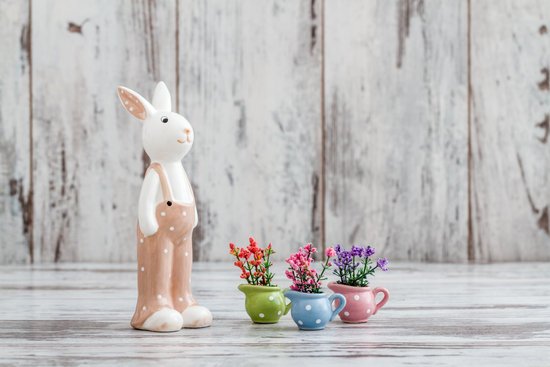 canva decorative cute rabbit doll on white wooden background MADGfuGroJk