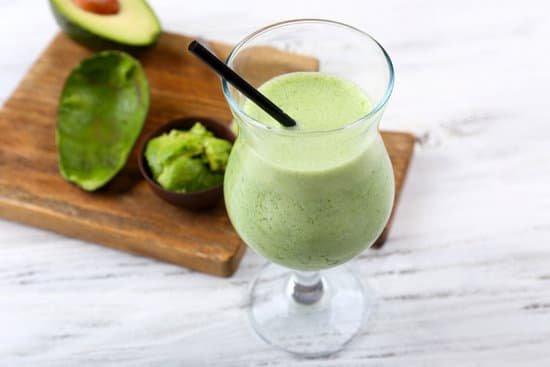 canva delicious fresh avocado smoothie on white wooden background MAD Qs cWgI