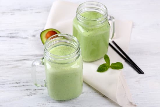 canva delicious fresh avocado smoothie on white wooden table MAD QgI 5l4