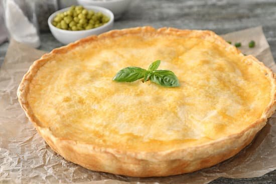 canva delicious pie with basil on parchment MAD9T5JCjoU