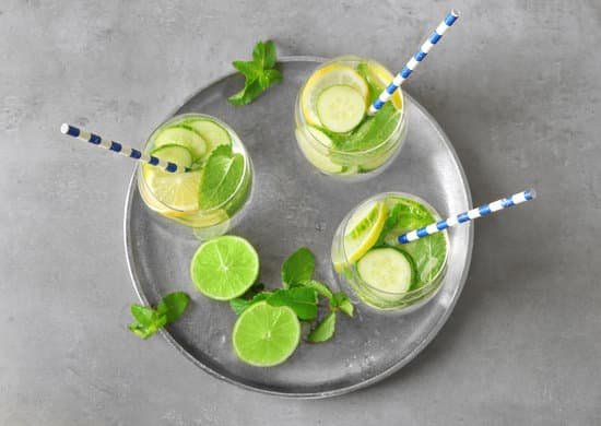 canva delicious refreshing water with cucumber in glasses on metal tray MAD9T5TM91U