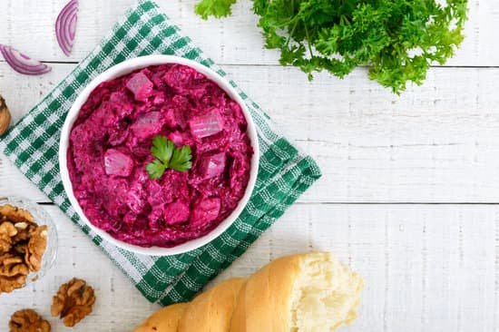 canva delicious salad with boiled beets and bread on white wooden table MAEFCTGwA7c
