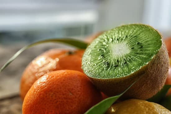 canva different fresh citrus fruits with half of kiwi on top MAD9acWzrUY