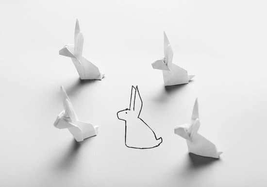 canva drawn rabbit among made of origami on light background MAEk5ImOeGQ