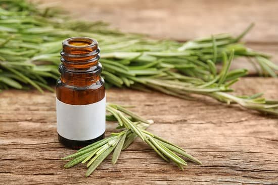 canva dropper bottle and herbs on wooden background MAD