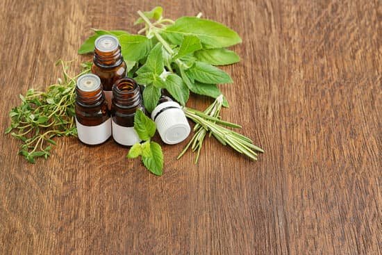 canva dropper bottles and herbs on wooden background MAD Q3Md VI