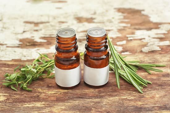 canva dropper bottles and herbs on wooden background MAD