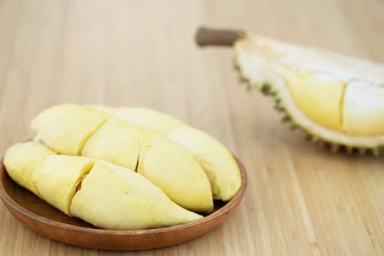 canva durian flesh on wooden plate MAECCufnvcc