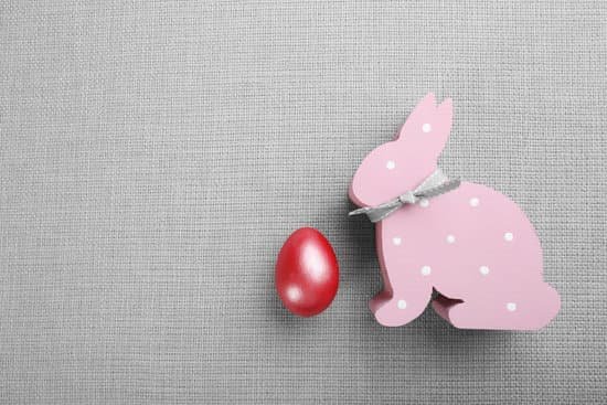 canva easter egg with pink wooden rabbit MAD QqqrgbU