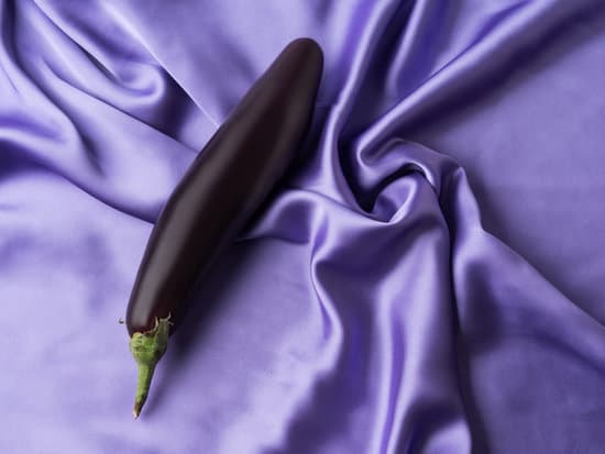 canva eggplant on purple crumpled silk sheet MAEfC4RPFfo