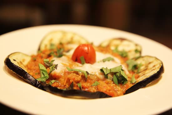 canva eggplant with tomato sauce up close