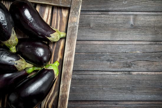 canva eggplants on a wooden tray flatlay MAEPnoRMyAU