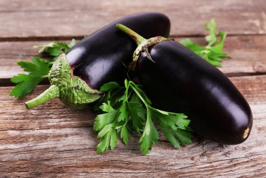 canva eggplants on wooden background MAD MU7dIGw