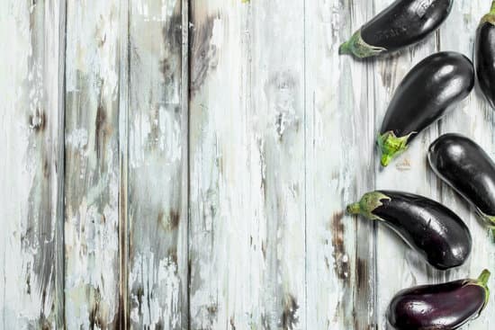 canva eggplants on wooden background flatlay MAEPRdLWm U