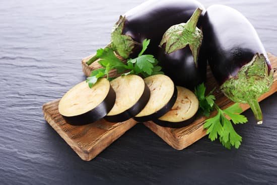 canva eggplants on wooden board MAD MfgPlvw