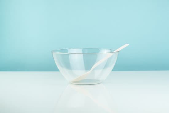canva empty glass bowl and spoon on a table