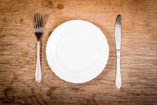 canva empty plate and cutlery on the table MADQUlT6h6c