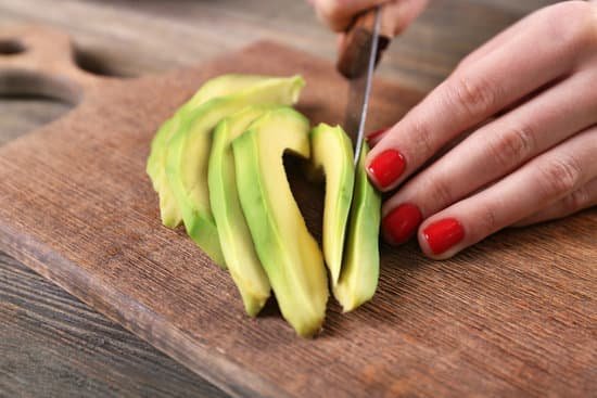 canva female hands cutting avocado into slices close up MAD QpTd1Uk