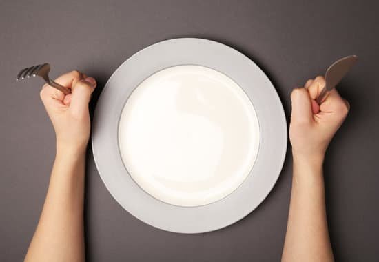 canva female hands with cutlery and empty plate MAD