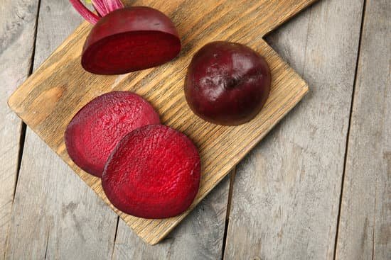 canva flatlay of sliced beets on a wooden board MAD MdmFqYY