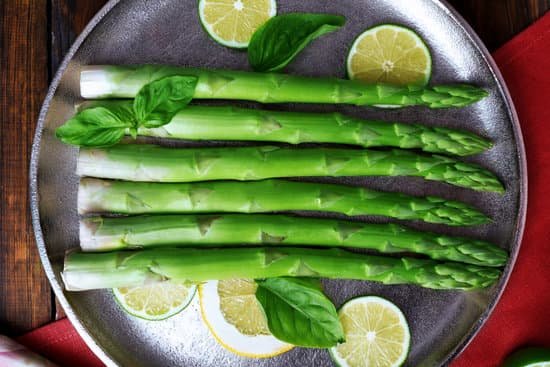 canva fresh asparagus and lime slices on the pan MAD MQHSHSA