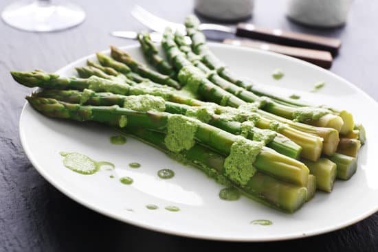 canva fresh asparagus dish in green sauce on the table MAD MsKsovc