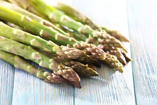 canva fresh asparagus on a wooden table MAD MTe 7ys