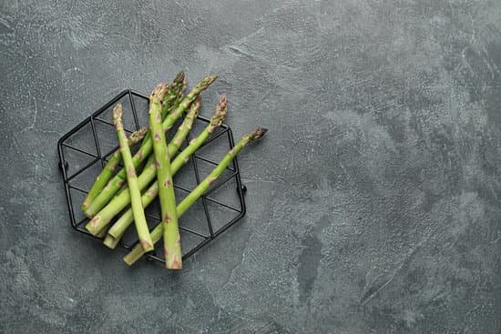 canva fresh asparagus on gray background