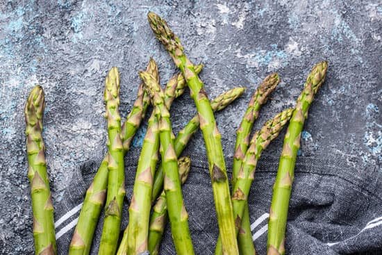 canva fresh asparagus on grunge table