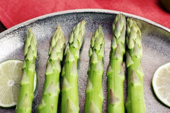 canva fresh asparagus on pan with lime MAD MT1gr4o