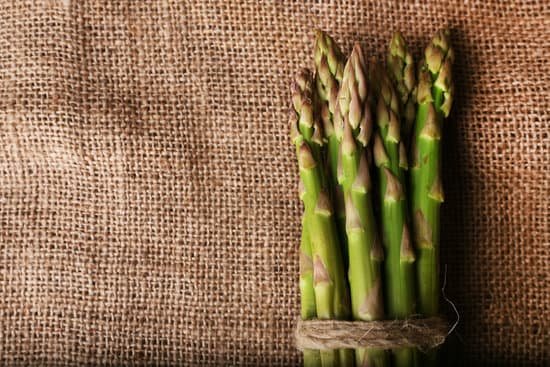 canva fresh asparagus on sackcloth background MAD MVddQKg