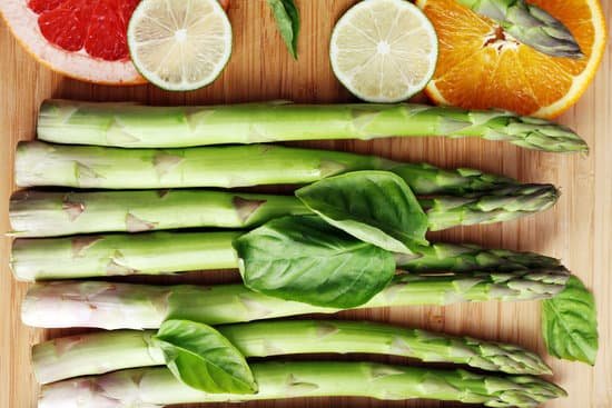 canva fresh asparagus on wooden background MAD MUBTmDo