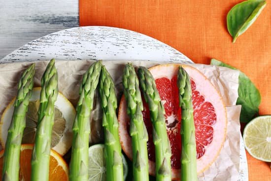 canva fresh asparagus with fruit slices on a wooden tray MAD Mcn c1s